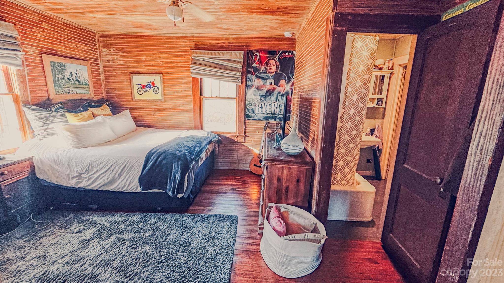 680 Cedar Hill Road Alexander, NC 28701 - Photo 8 of 17 a bedroom with a bed and wooden floor