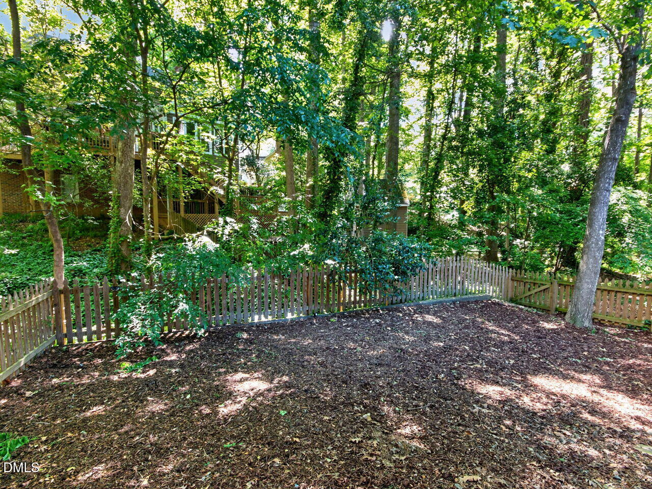 6004 Tarnhour Court Raleigh, NC 27612 - Photo 36 of 44 a backyard of a house with lots of green space