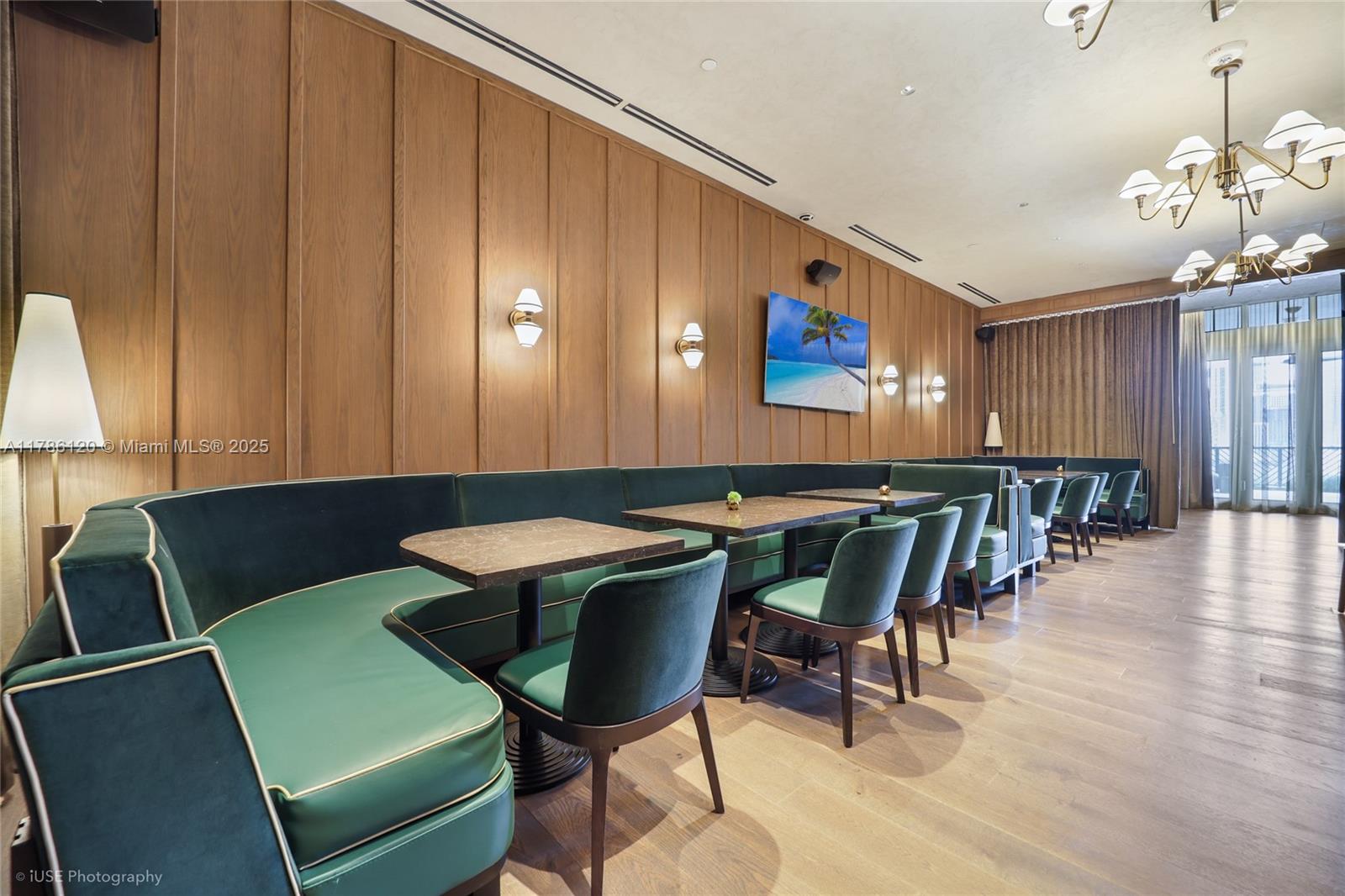 159 Northeast 6th Street, Unit 4714 Miami, FL 33132 - Photo 13 of 19 a view of a dining room with furniture and wooden floor