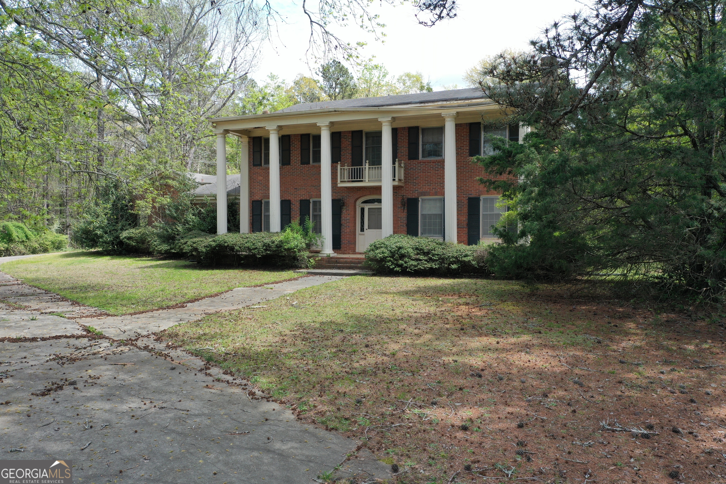 2660 Old Salem Road Southeast Conyers, GA 30013 - Photo 2 of 7 a front view of a house with garden and trees