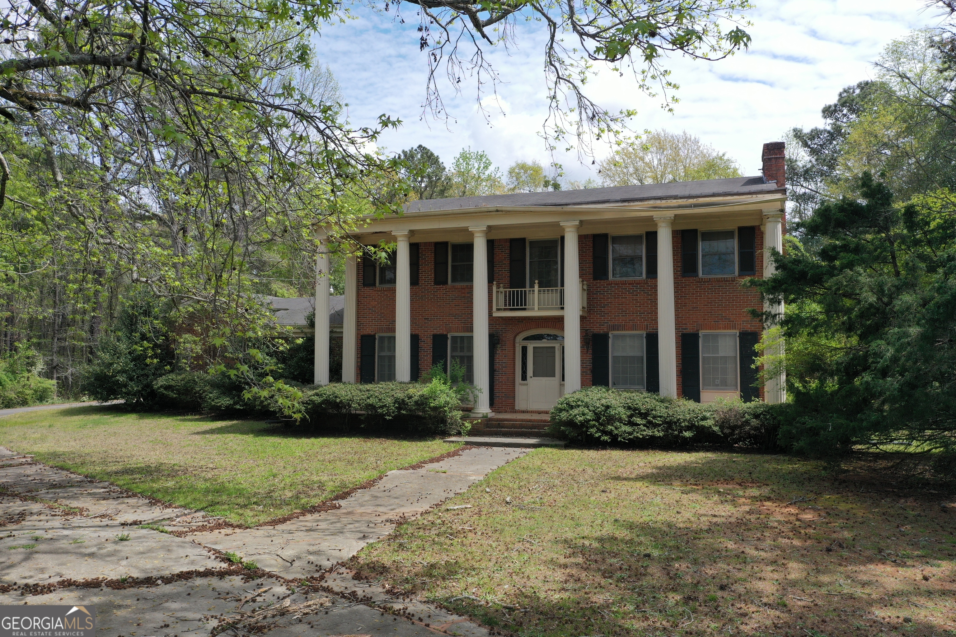 2660 Old Salem Road Southeast Conyers, GA 30013 - Photo 3 of 7 a front view of a house with garden