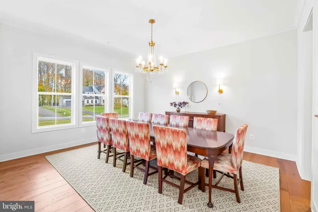 a living room with furniture a fireplace and a large window