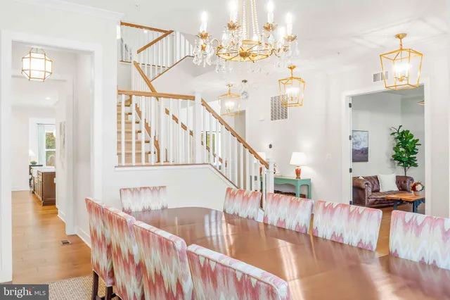 a living room with furniture a fireplace and a large window