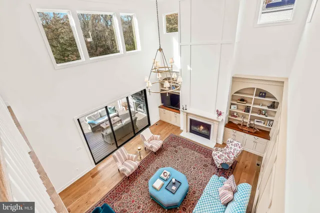 a view of an house with backyard and road