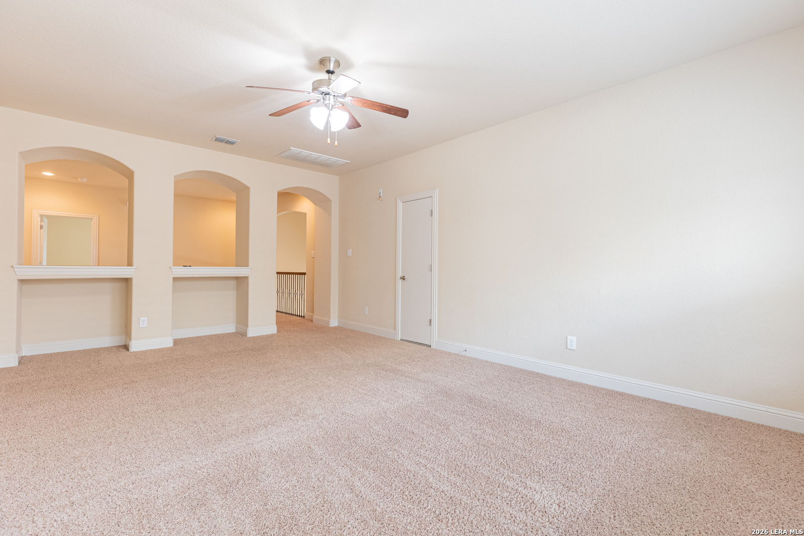 8103 Mystic Chase Boerne, TX 78015 - Photo 30 of 49 an empty room with chandelier fan and windows