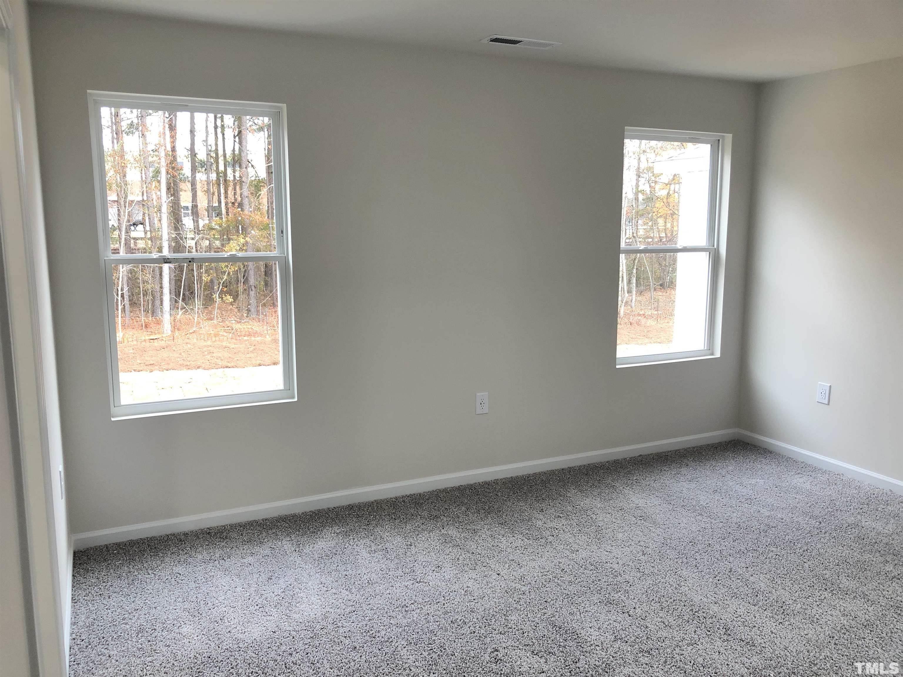 159 Red Valor Street Garner, NC 27529 - Photo 17 of 24 an empty room with a window