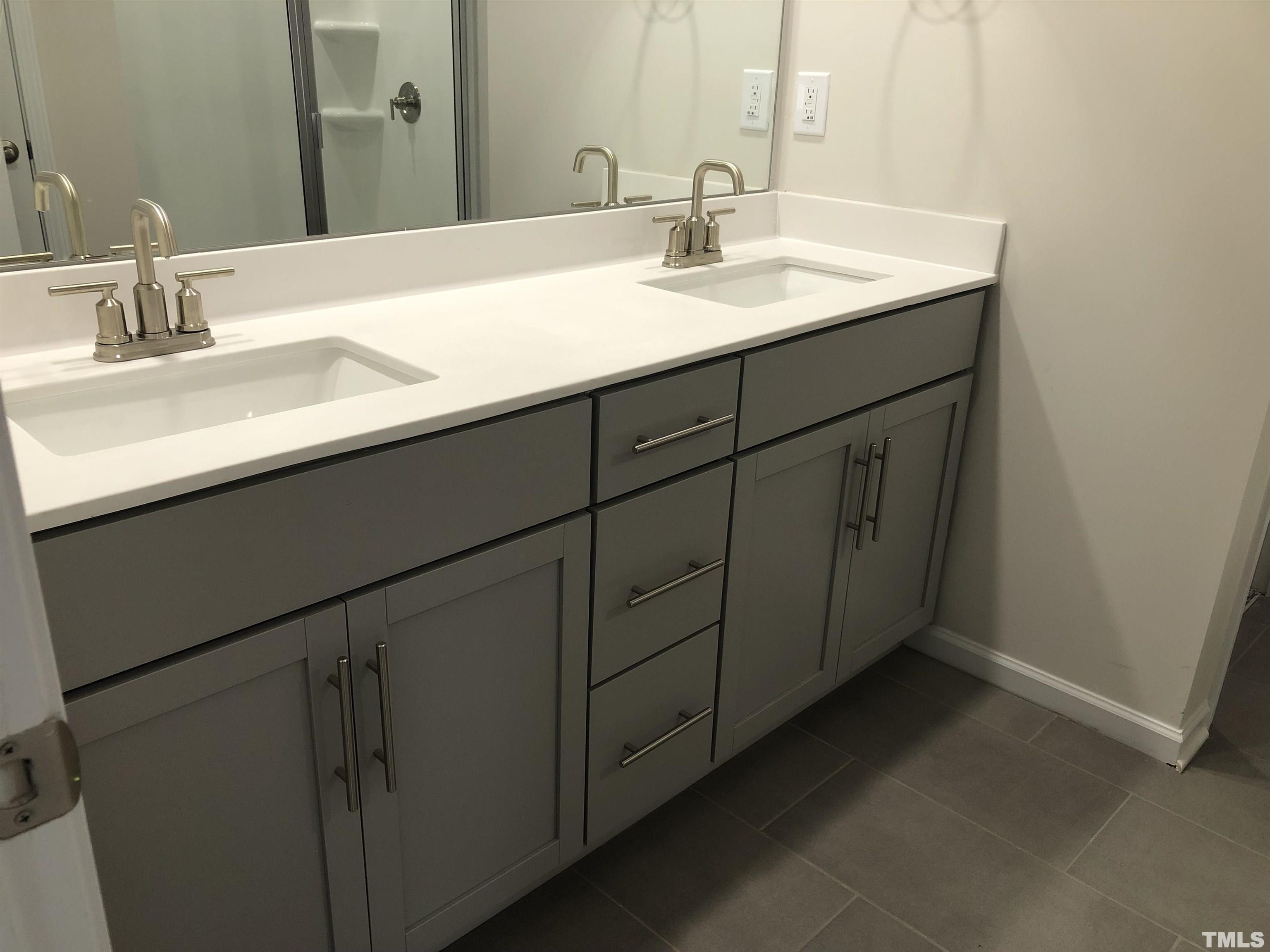 159 Red Valor Street Garner, NC 27529 - Photo 19 of 24 a bathroom with a sink and a mirror