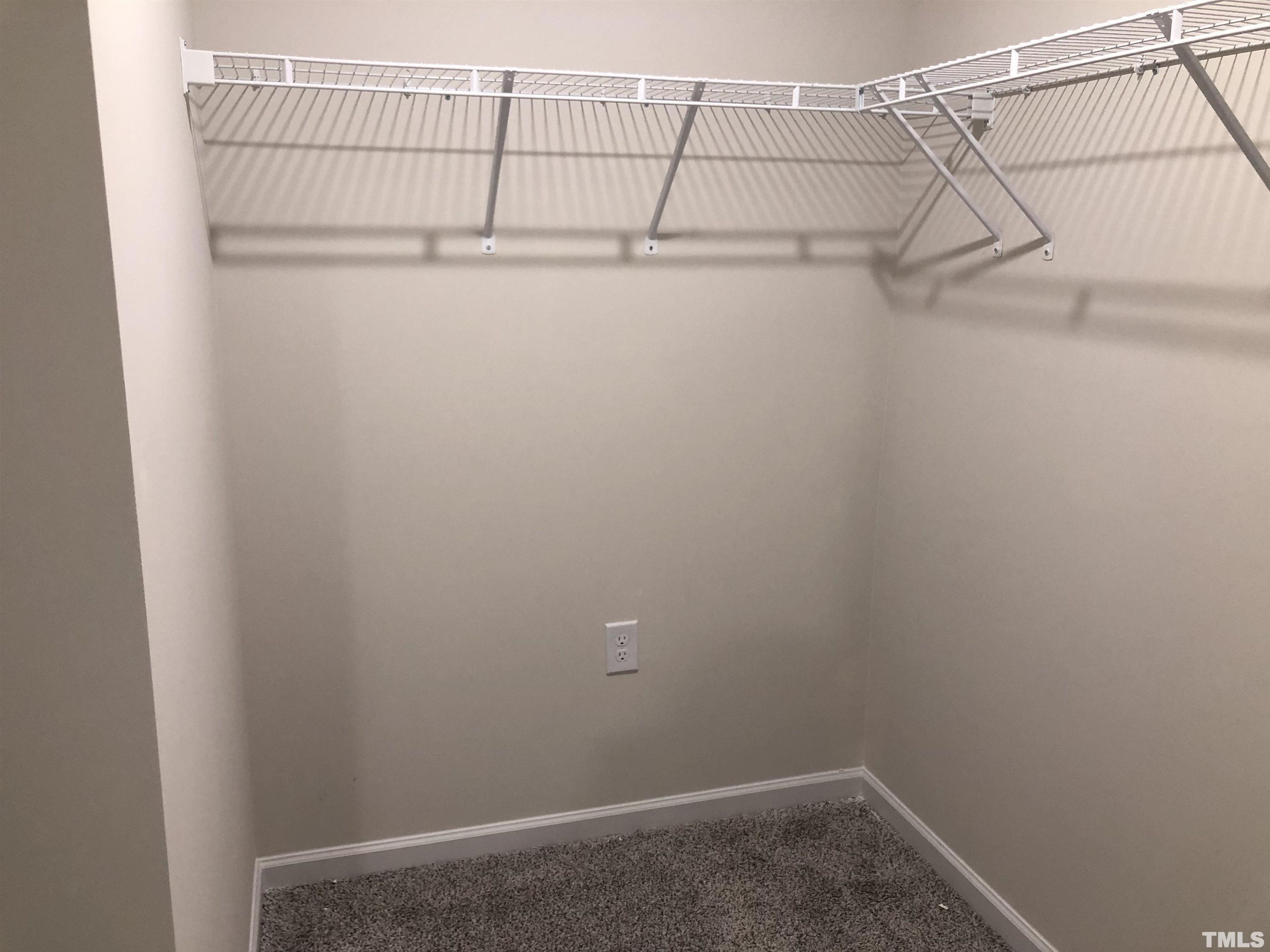 159 Red Valor Street Garner, NC 27529 - Photo 21 of 24 a view of a room with racks on the wall