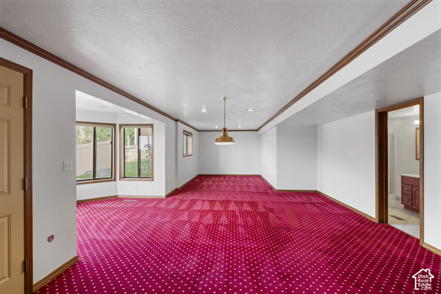 1373 Pheasant Ridge Circle Bountiful, UT 84010 - Photo 35 of 50 Expansive carpeted area with a bay window, recessed lighting, and a suspended light fixture