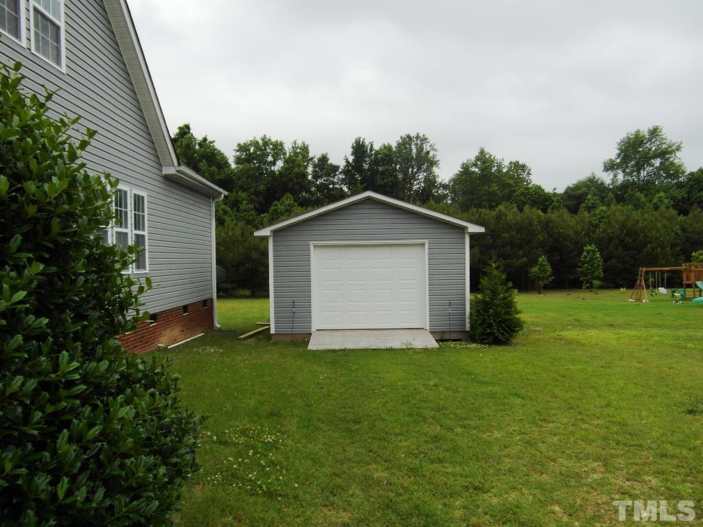 4936 Contender Drive Raleigh, NC 27603 - Photo 24 of 25 a view of a backyard with a garden