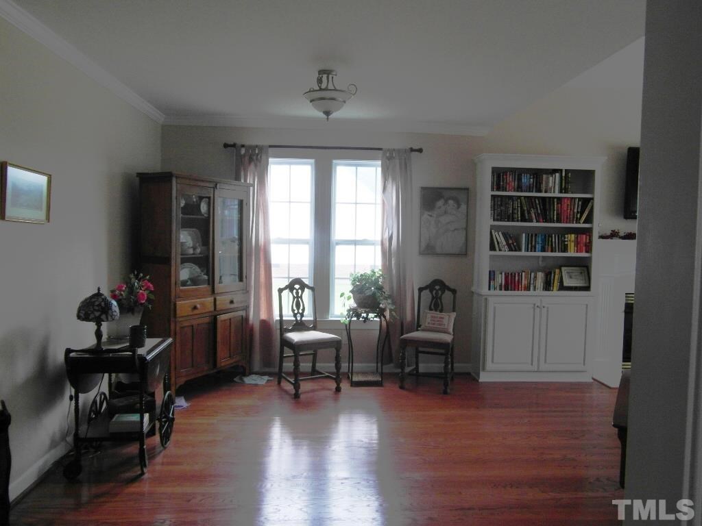 4936 Contender Drive Raleigh, NC 27603 - Photo 4 of 25 a livingroom with workspace and a window