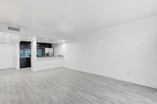 a view of kitchen with wooden floor