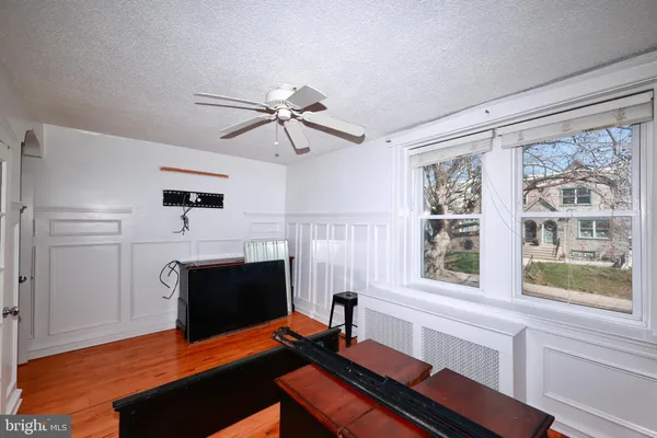 a living room with furniture fireplace and flat screen tv