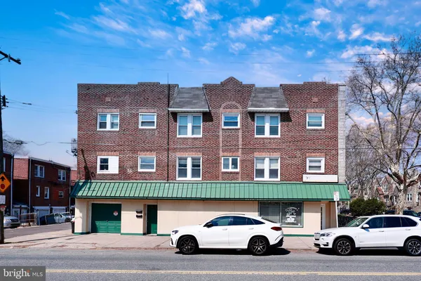 a view of a car parked in front of a building