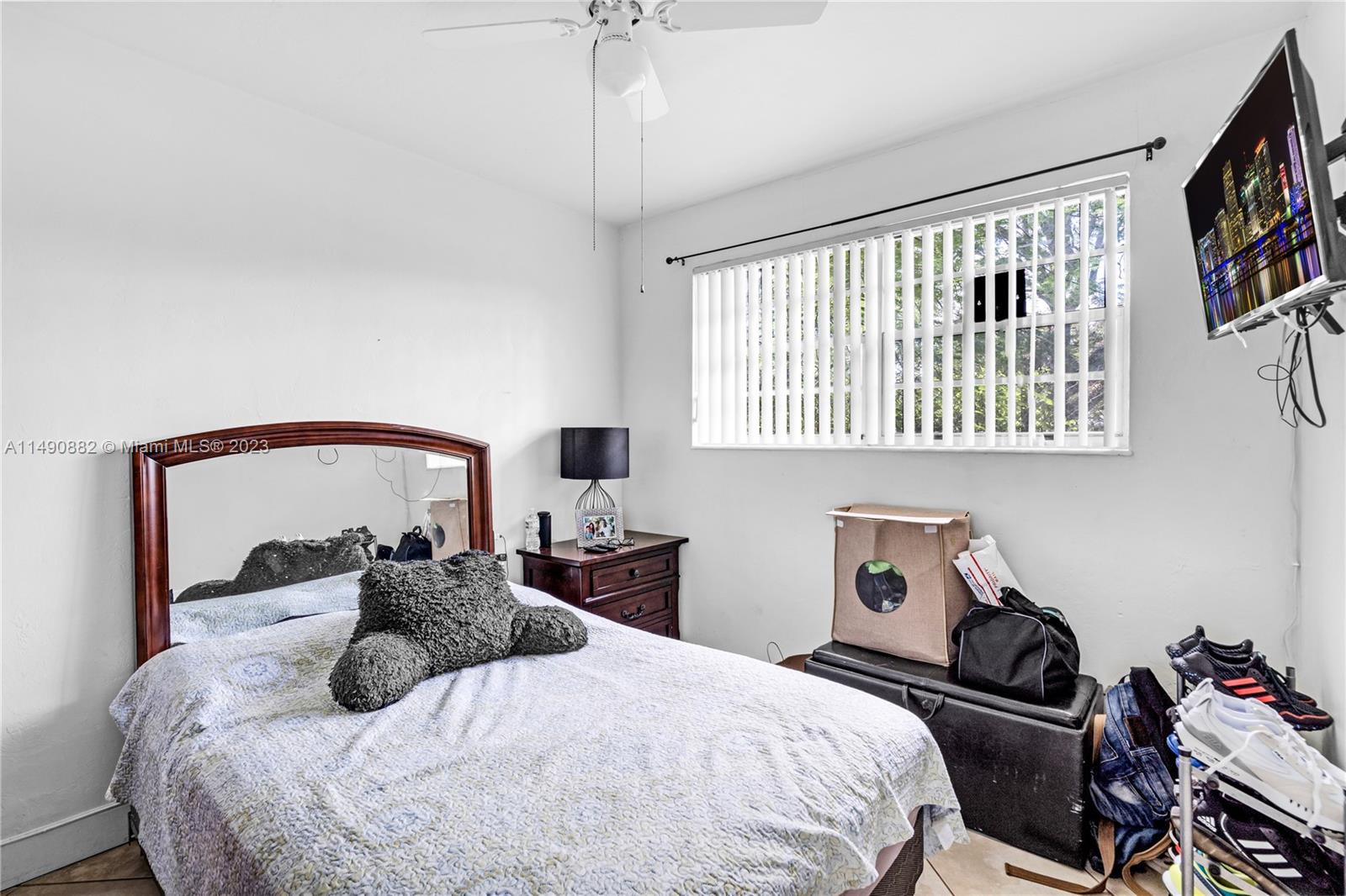 3551 Frow Avenue Miami, FL 33133 - Photo 11 of 22 a bedroom with a bed and a window