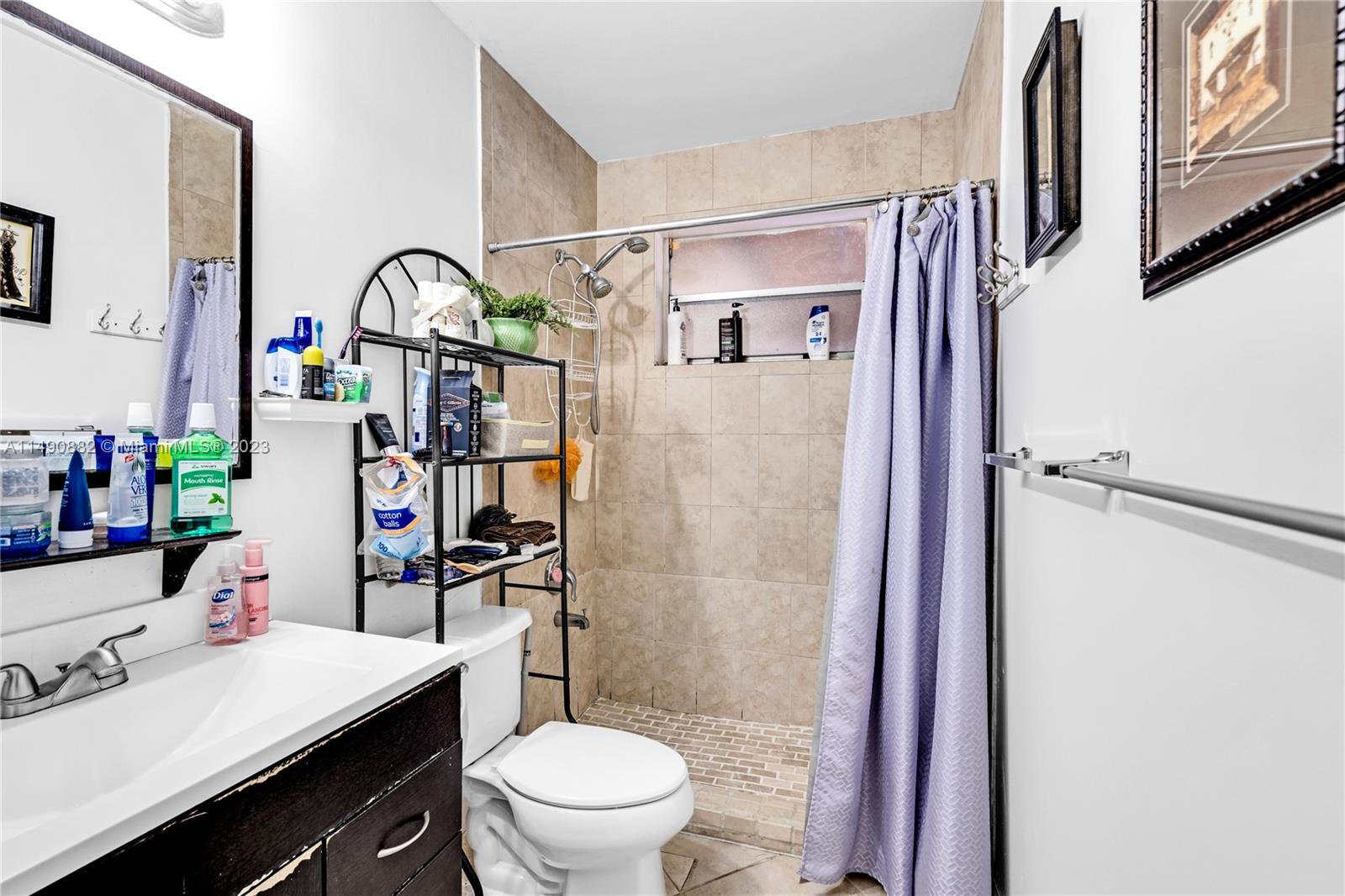 3551 Frow Avenue Miami, FL 33133 - Photo 12 of 22 a bathroom with a sink toilet and shower