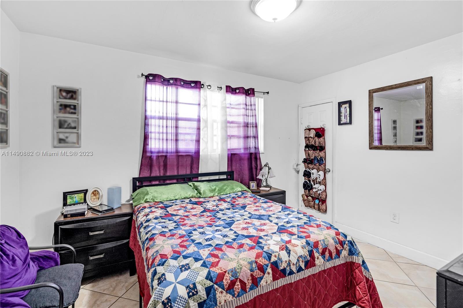 3551 Frow Avenue Miami, FL 33133 - Photo 14 of 22 a bedroom with a bed and a window