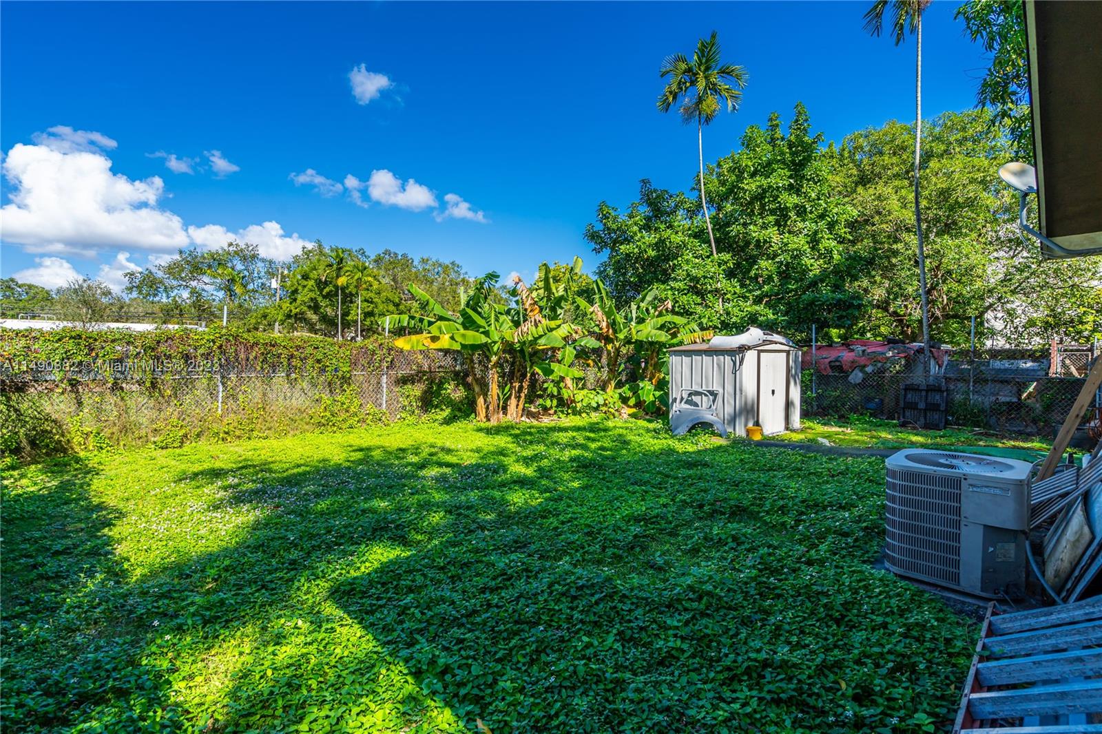 3551 Frow Avenue Miami, FL 33133 - Photo 17 of 22 a view of a garden with chairs