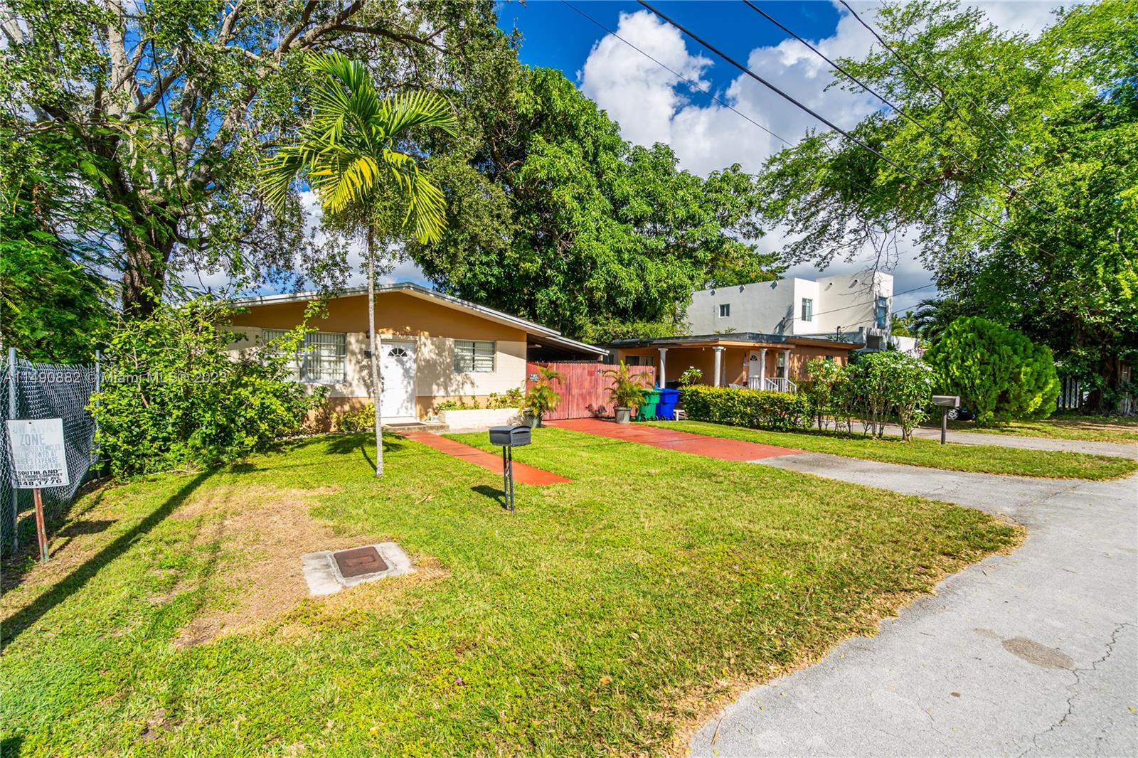 3551 Frow Avenue Miami, FL 33133 - Photo 2 of 22 a swimming pool with some trees in the background