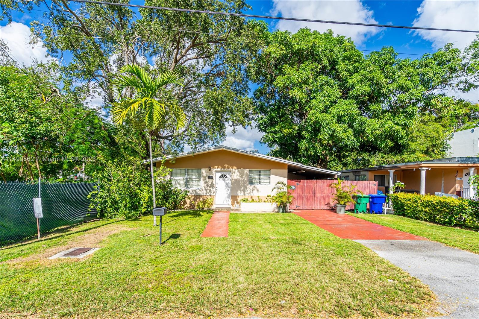 3551 Frow Avenue Miami, FL 33133 - Photo 3 of 22 a view of a backyard with a garden and plants