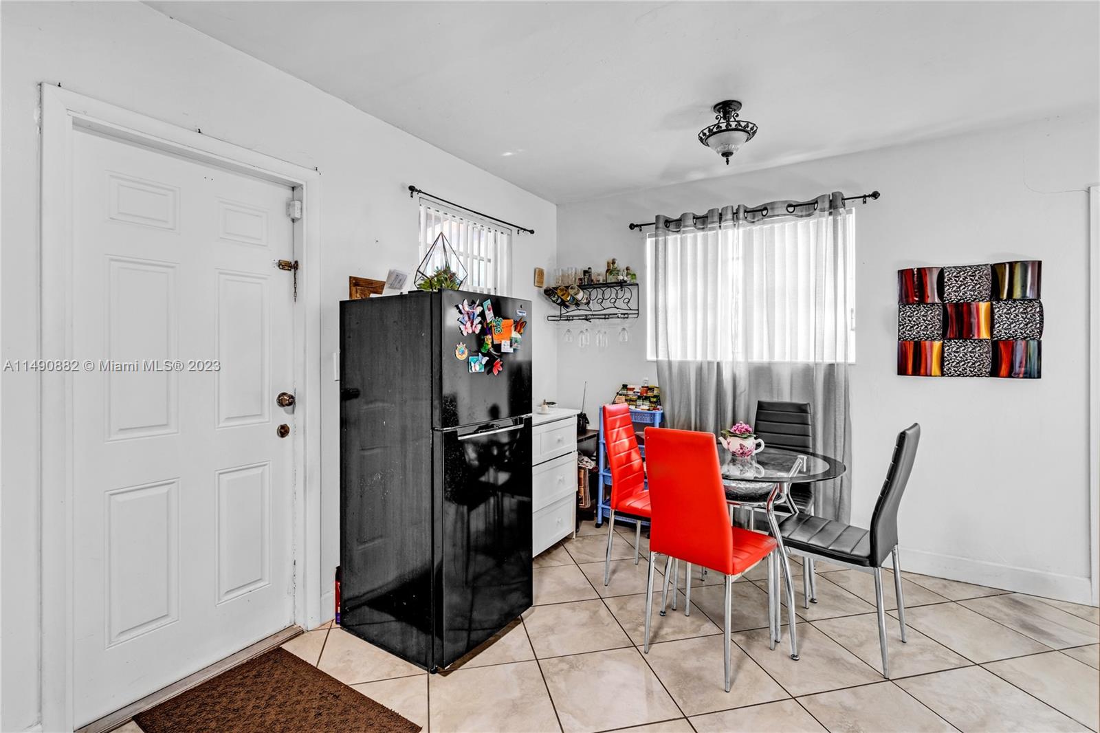 3551 Frow Avenue Miami, FL 33133 - Photo 6 of 22 a living room with furniture and a window