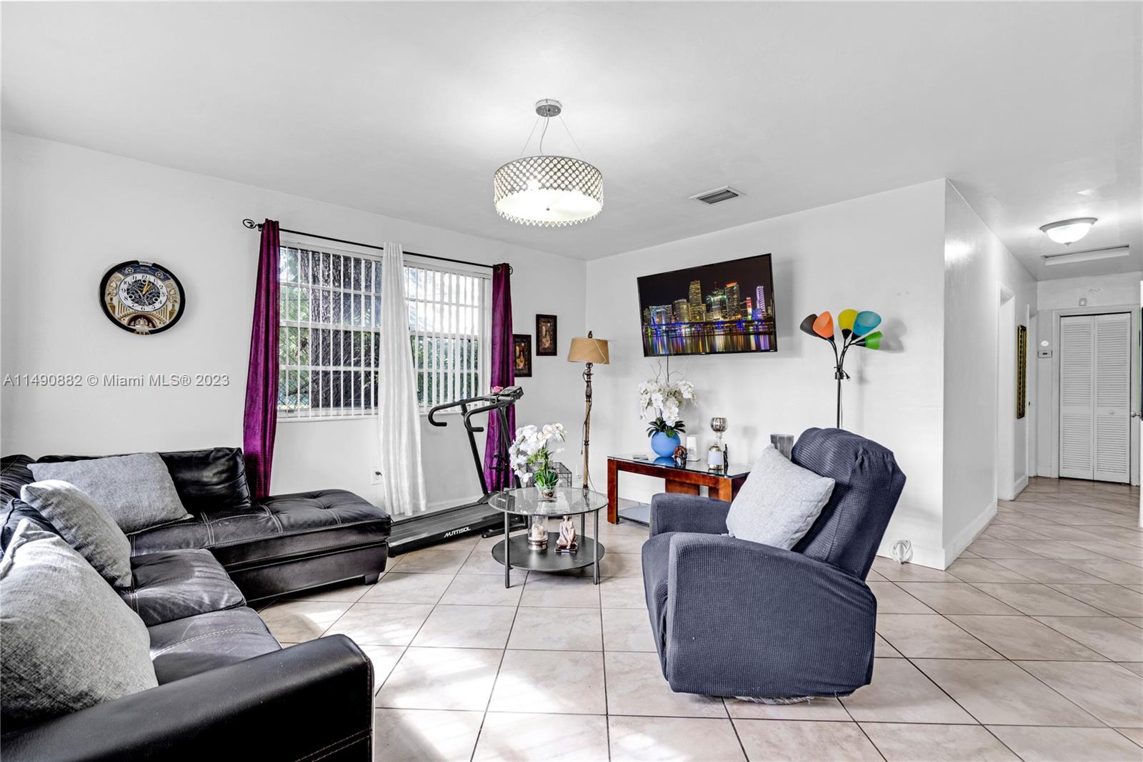 3551 Frow Avenue Miami, FL 33133 - Photo 7 of 22 a living room with furniture and a flat screen tv