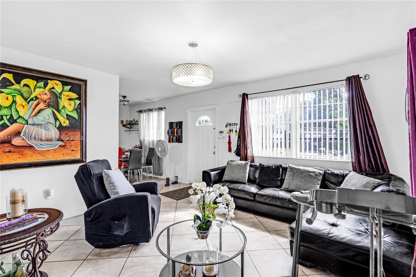 3551 Frow Avenue Miami, FL 33133 - Photo 8 of 22 a living room with furniture and a large window