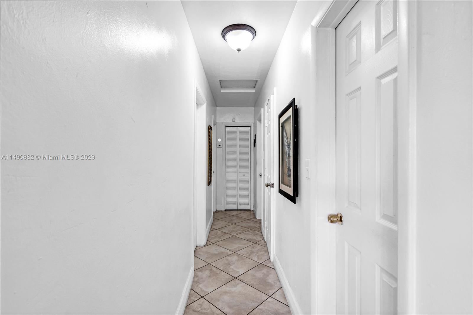 3551 Frow Avenue Miami, FL 33133 - Photo 9 of 22 a view of a hallway with windows and stairs