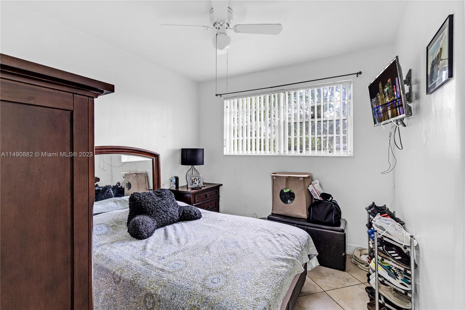 3551 Frow Avenue Miami, FL 33133 - Photo 10 of 22 a bedroom with a bed and a window