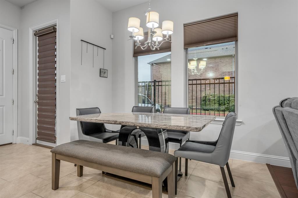 1229 Harris Hawk Way Arlington, TX 76005 - Photo 15 of 40 a view of a dining room with furniture window and outside view