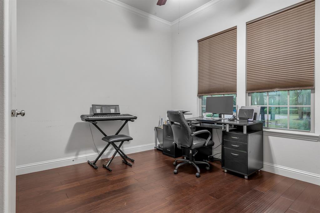 1229 Harris Hawk Way Arlington, TX 76005 - Photo 16 of 40 a view of a workspace with furniture and a window