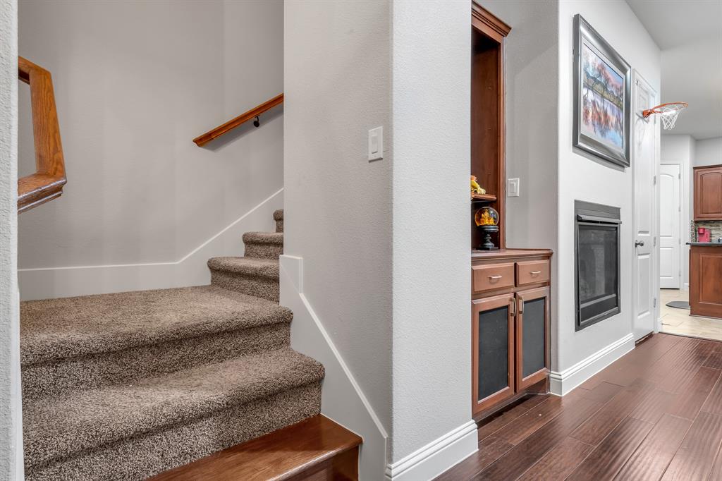 1229 Harris Hawk Way Arlington, TX 76005 - Photo 18 of 40 a view of entryway and hall with wooden floor