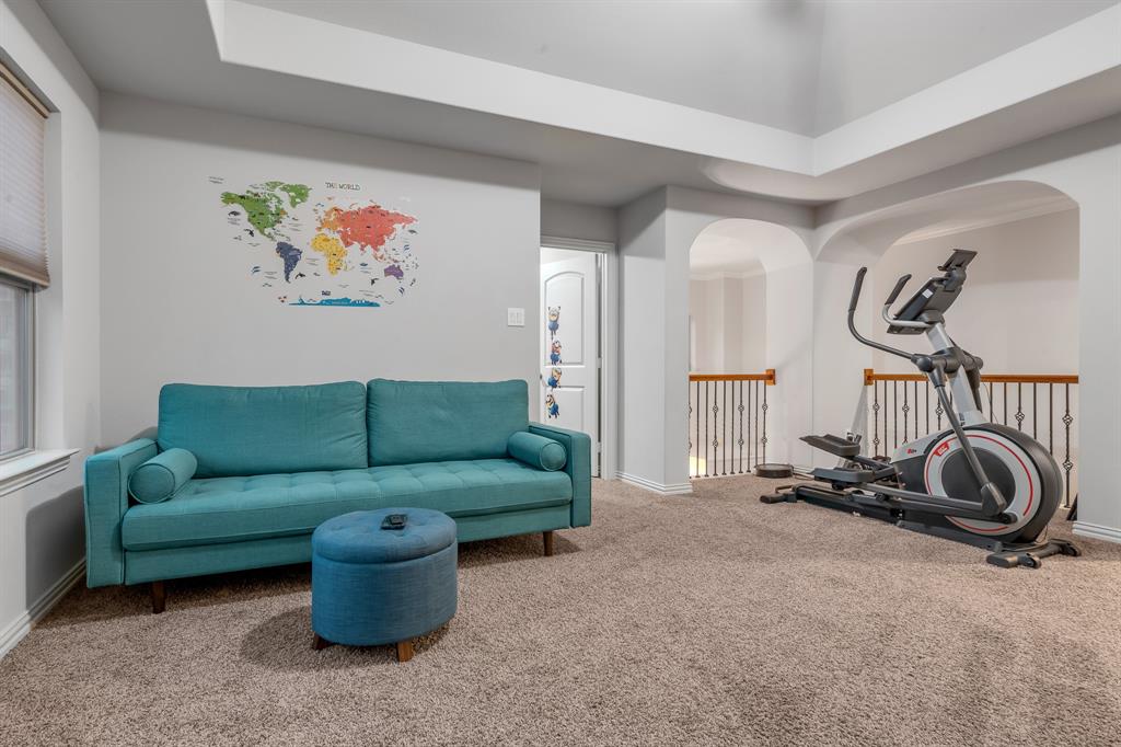 1229 Harris Hawk Way Arlington, TX 76005 - Photo 20 of 40 a living room with furniture and a gym