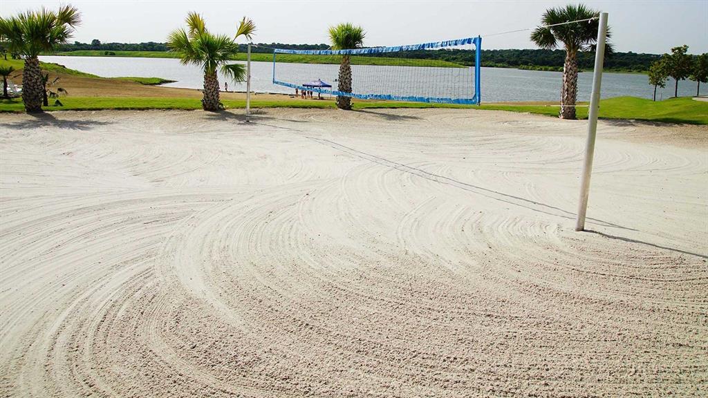 1229 Harris Hawk Way Arlington, TX 76005 - Photo 38 of 40 a view of swimming pool with large trees and lawn chair