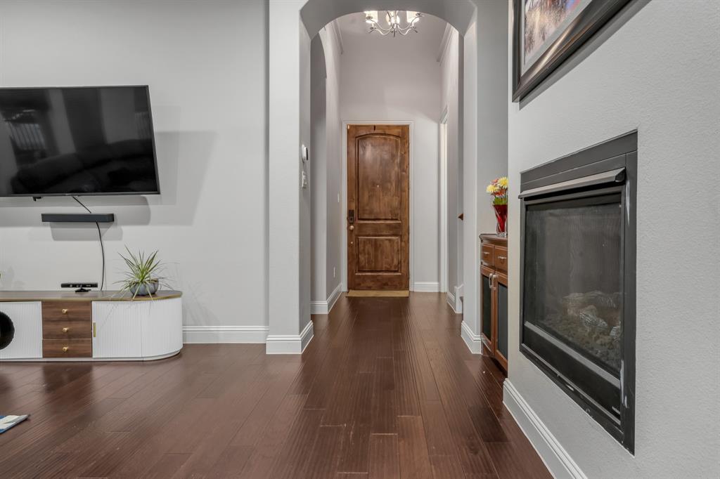 1229 Harris Hawk Way Arlington, TX 76005 - Photo 5 of 40 a view of a livingroom with wooden floor and furniture