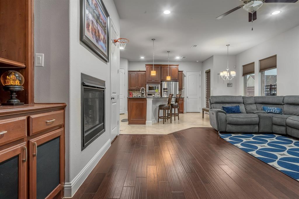 1229 Harris Hawk Way Arlington, TX 76005 - Photo 6 of 40 a living room with furniture and a wooden floor