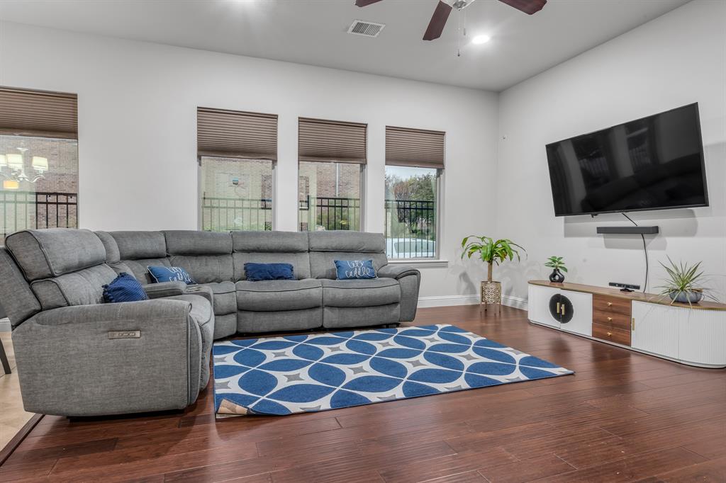 1229 Harris Hawk Way Arlington, TX 76005 - Photo 8 of 40 a living room with furniture and a flat screen tv