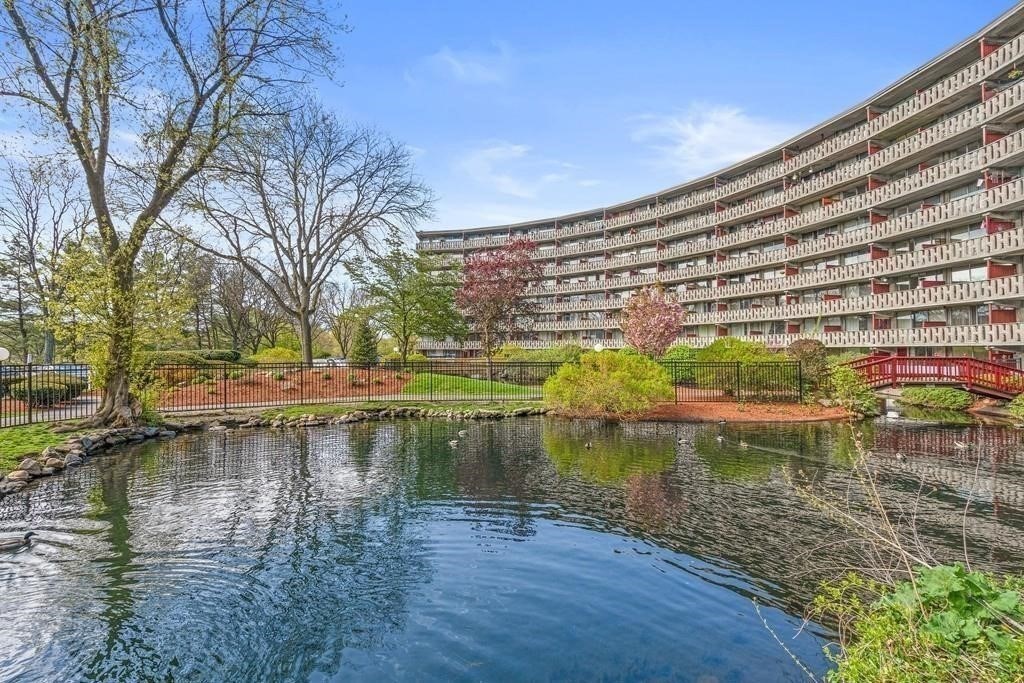 200 Swanton Street, Unit 318 Winchester, MA 01890 - Photo 2 of 9 a view of a lake with a building in the background