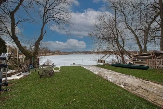 a view of a garden with an outdoor seating