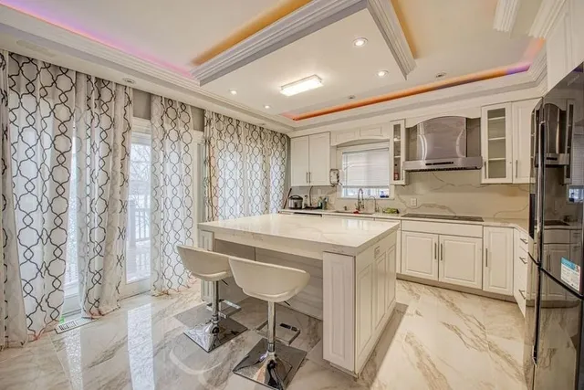 a kitchen with a sink cabinets and window