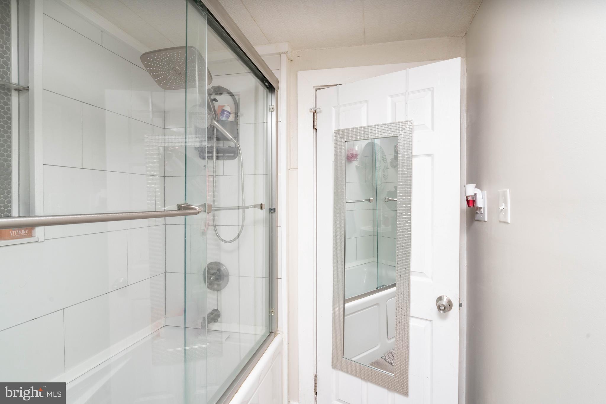 519 Clarendon Avenue Vineland, NJ 08360 - Photo 15 of 22 a bathroom with a bathtub and a shower