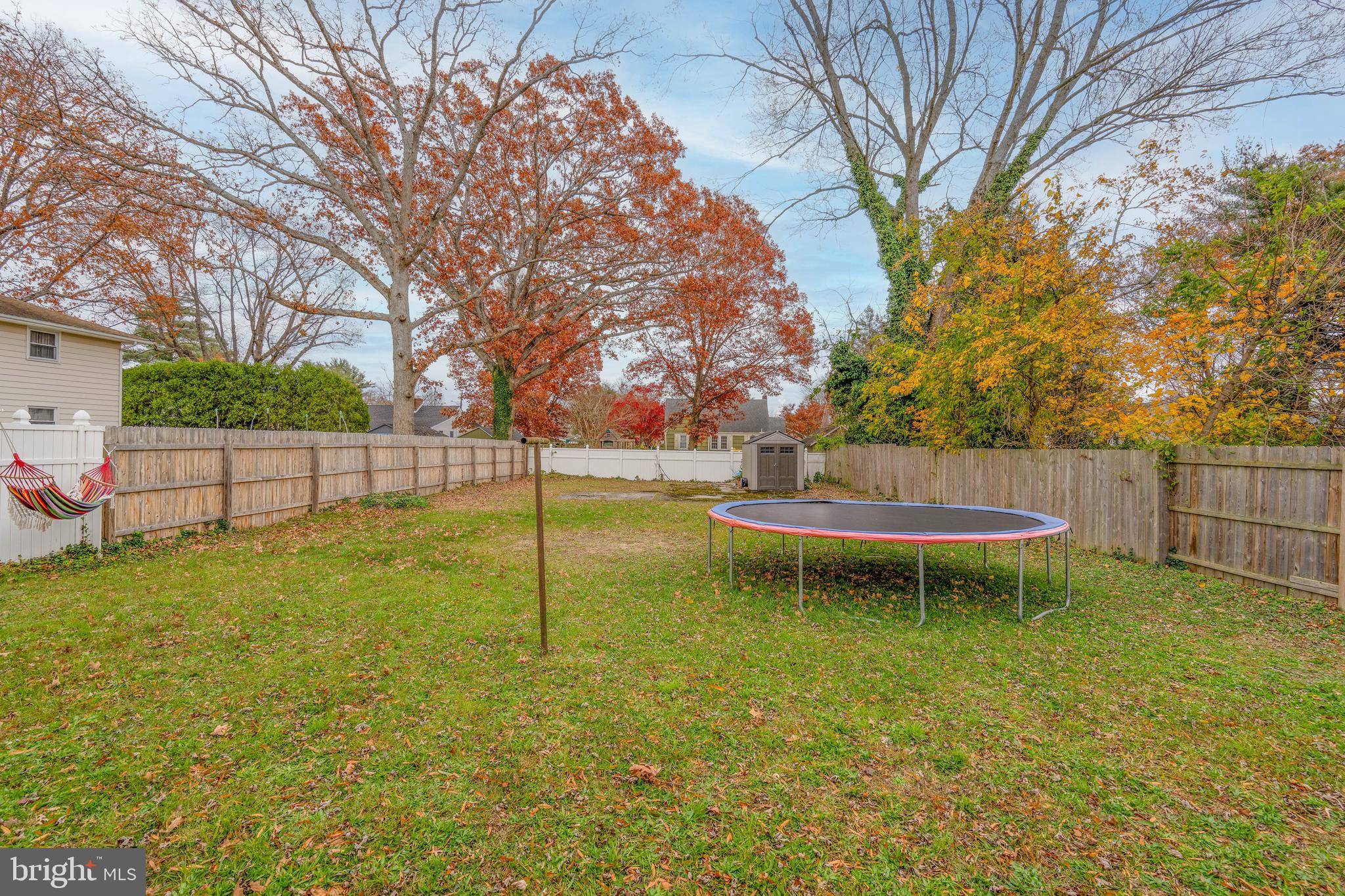 519 Clarendon Avenue Vineland, NJ 08360 - Photo 20 of 22 a view of a backyard with a small cabin
