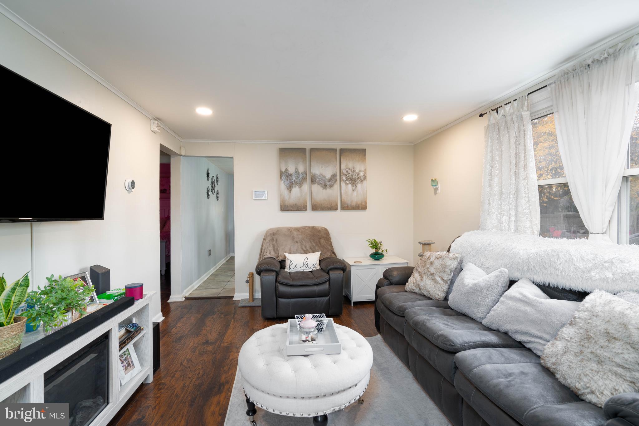 519 Clarendon Avenue Vineland, NJ 08360 - Photo 5 of 22 a living room with furniture and a flat screen tv