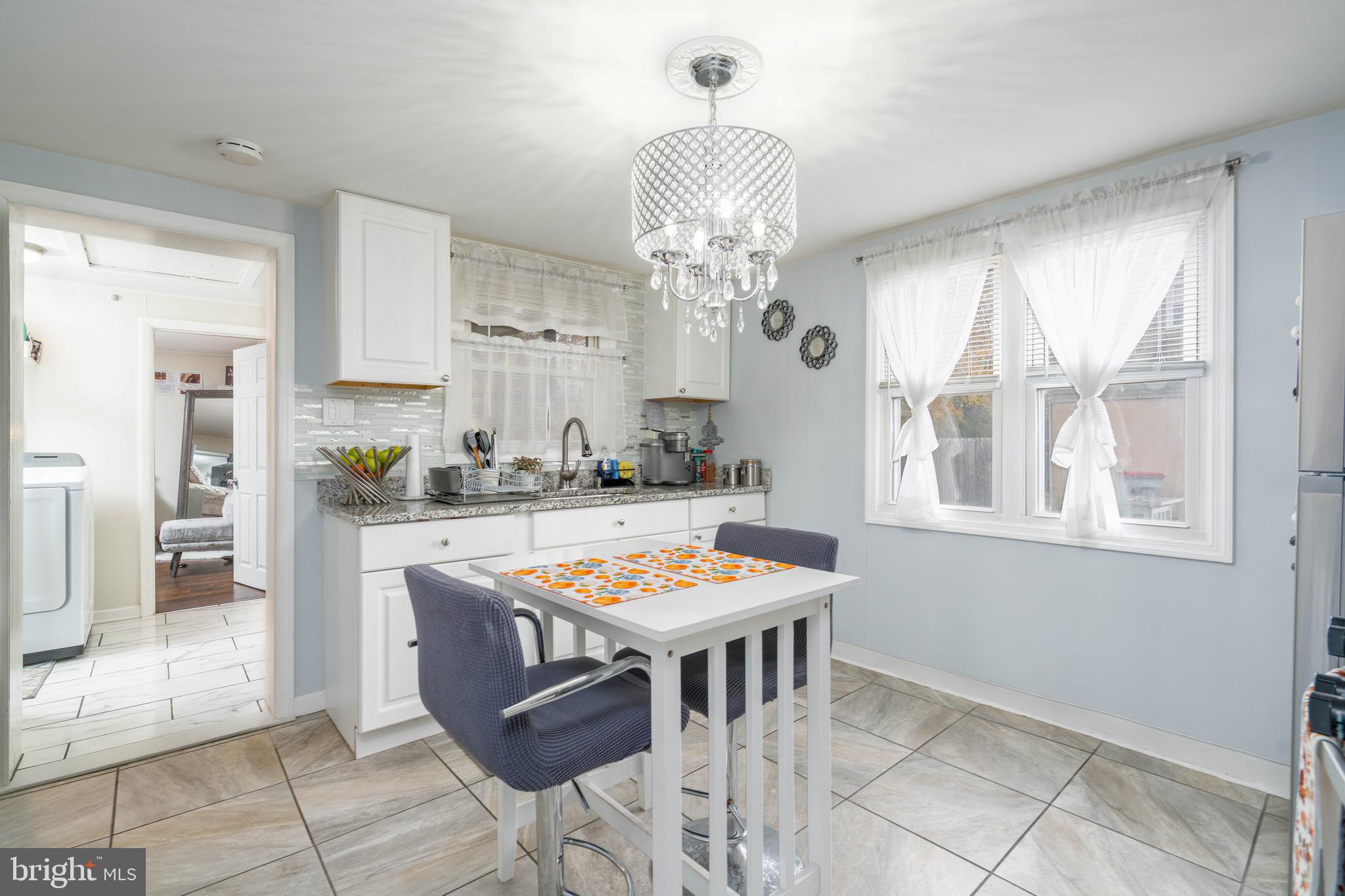 519 Clarendon Avenue Vineland, NJ 08360 - Photo 7 of 22 a view of a dining room with furniture and chandelier
