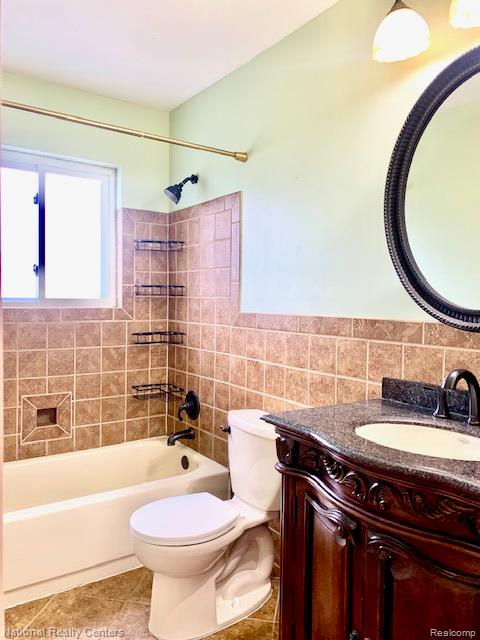 475 South Adams Road, Unit 19 Birmingham, MI 48009 - Photo 13 of 20 Bathroom featuring a vanity with an ornate wood-finish base, stone countertop, and an undermount sink