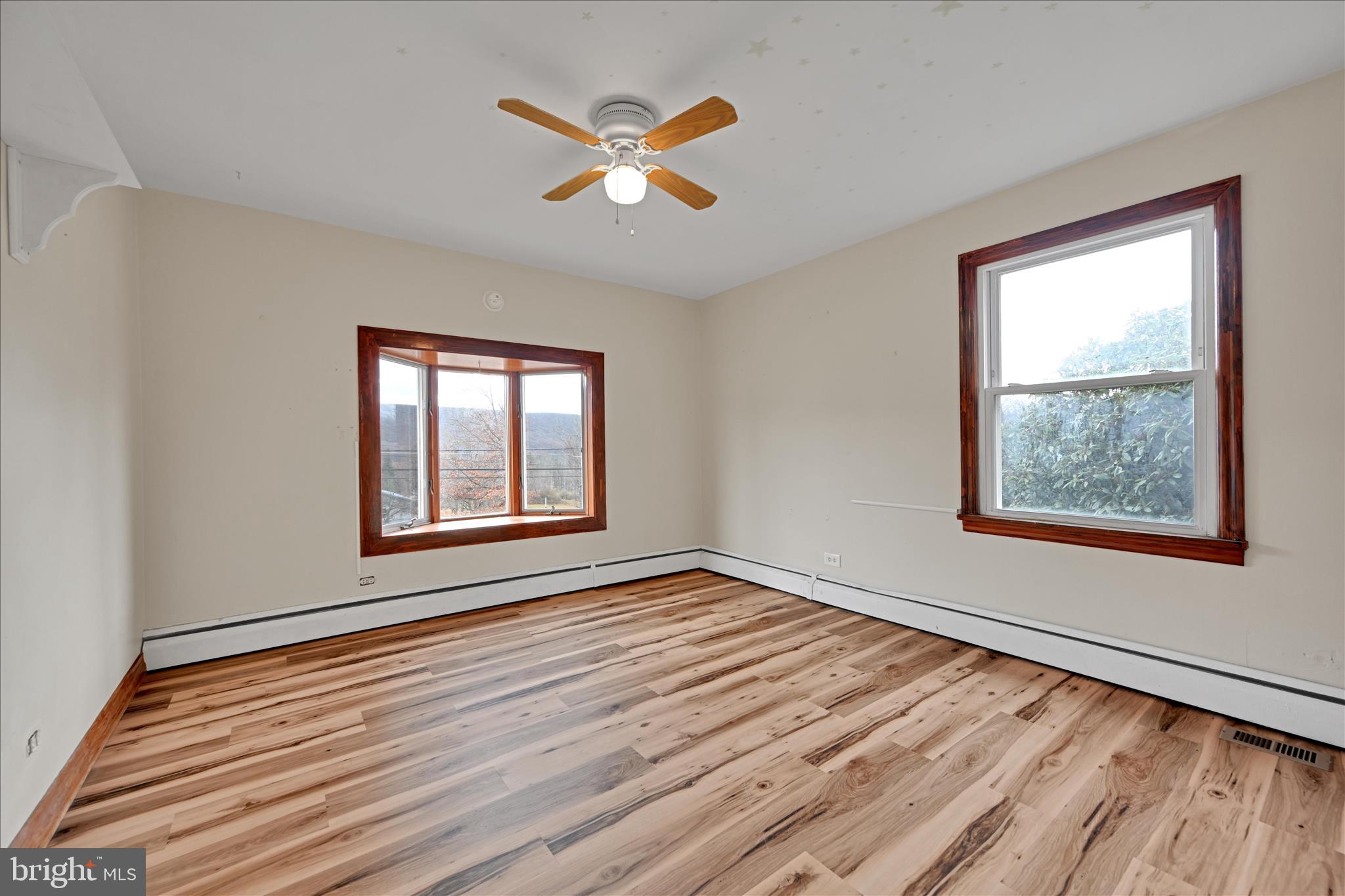 1012 Fountain Street Ashland, PA 17921 - Photo 15 of 34 a view of an empty room with wooden floor and a window