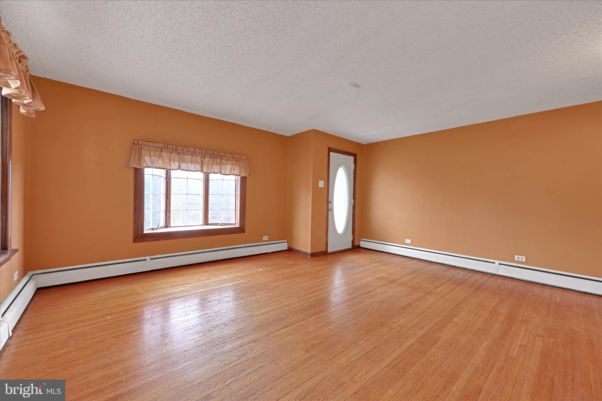 1012 Fountain Street Ashland, PA 17921 - Photo 8 of 34 an empty room with wooden floor and windows