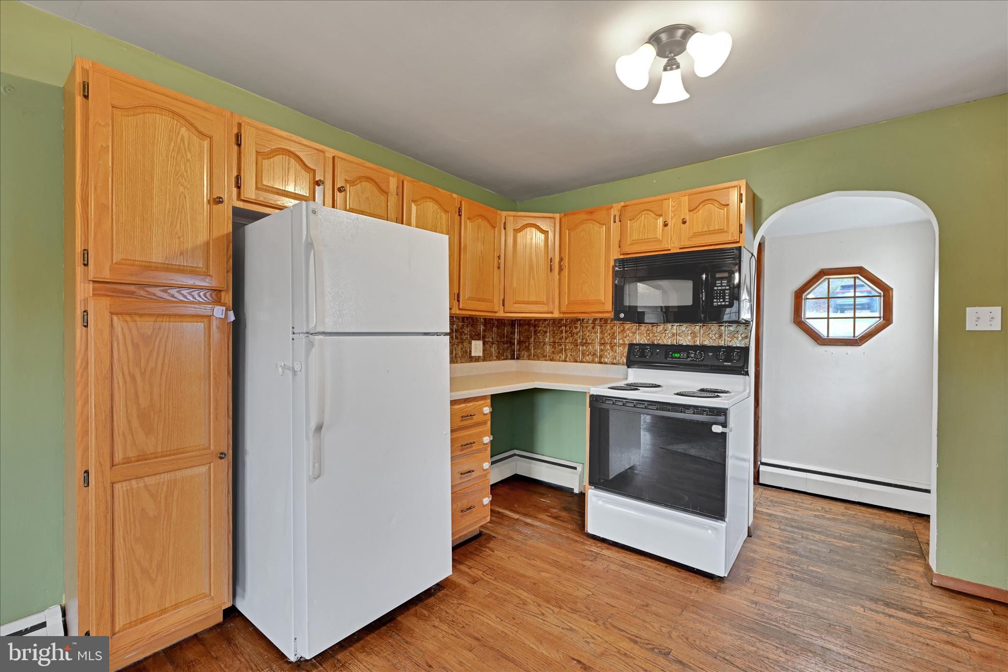1012 Fountain Street Ashland, PA 17921 - Photo 9 of 34 a kitchen with a refrigerator and a stove top oven
