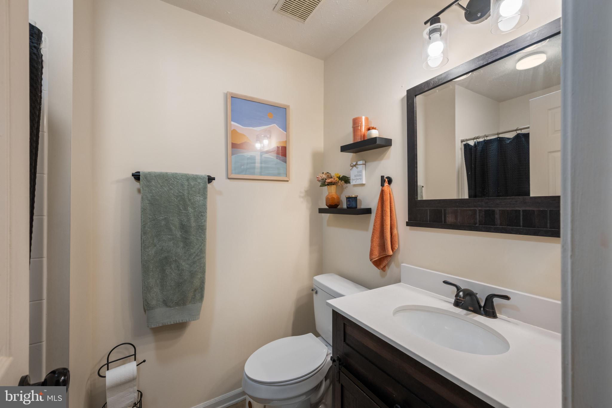 3105 Cardinal Way, Unit L Abingdon, MD 21009 - Photo 24 of 31 a bathroom with a toilet sink and mirror