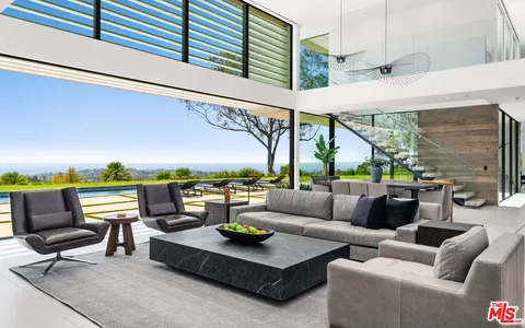 a view of swimming pool with outdoor seating and a yard